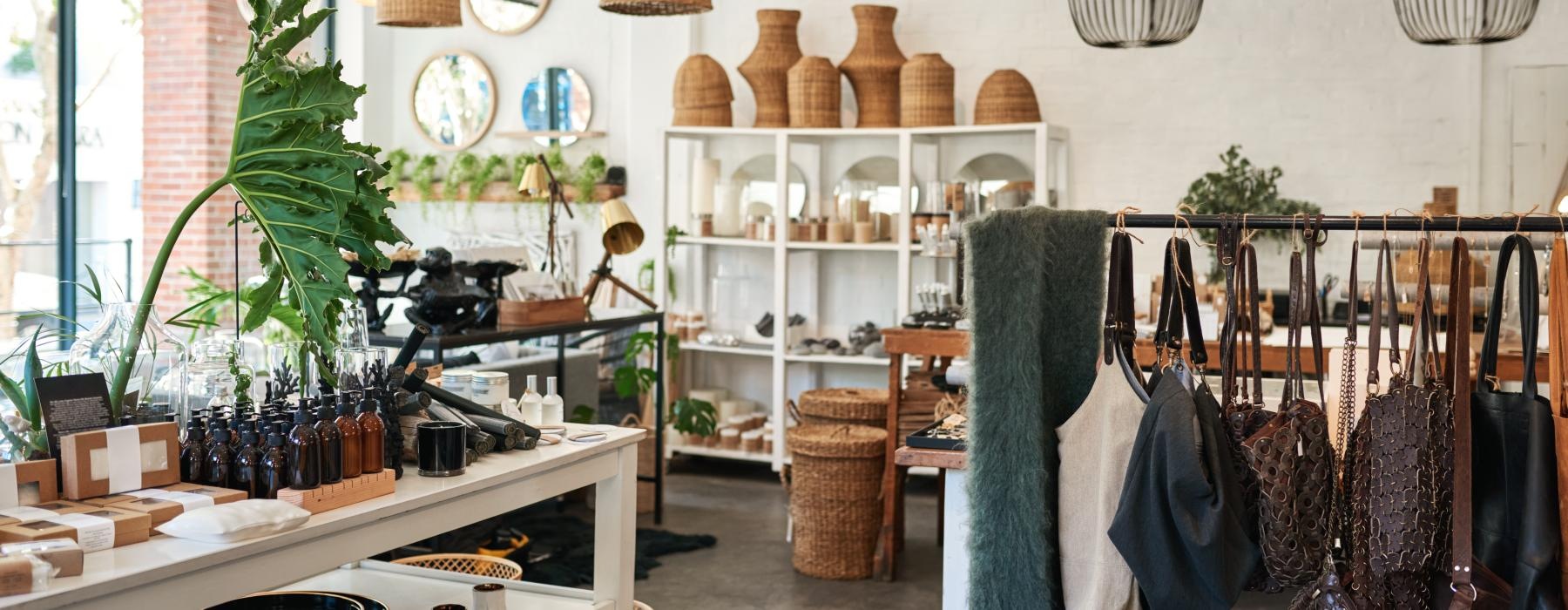 a room with a table and racks with objects on it